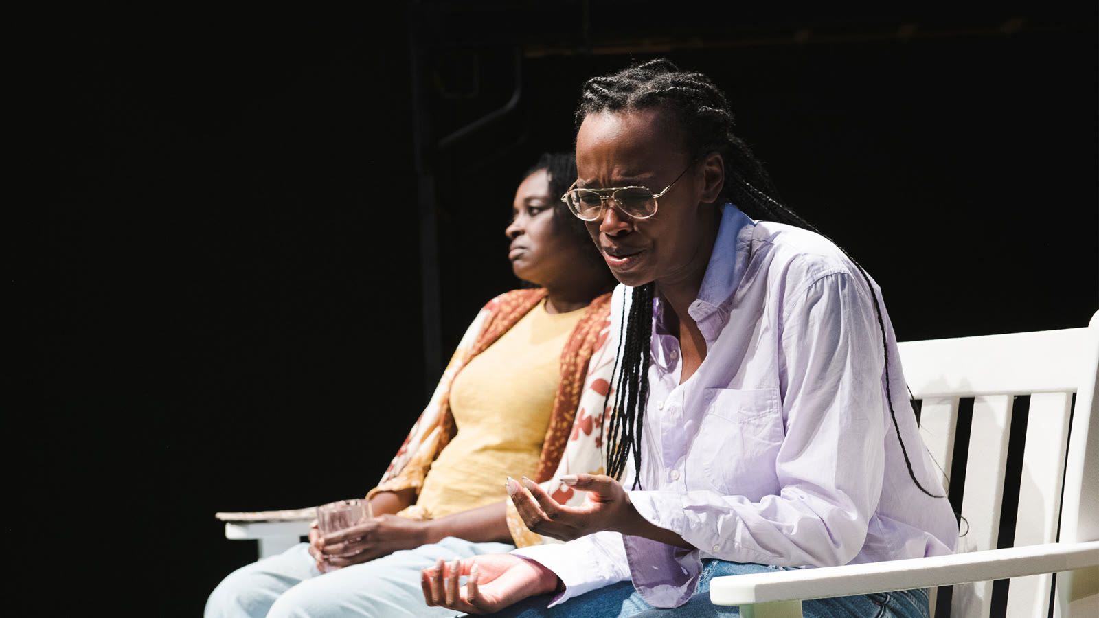 Fedna Jacquet as Princess seated onstage in Black Mother Lost Daughter